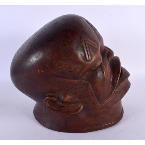 494 - A GOOD EARLY 20TH CENTURY AFRICAN TRIBAL MAKONDE LIPIKO WOOD MASK used by an elder to celebrate the ... 