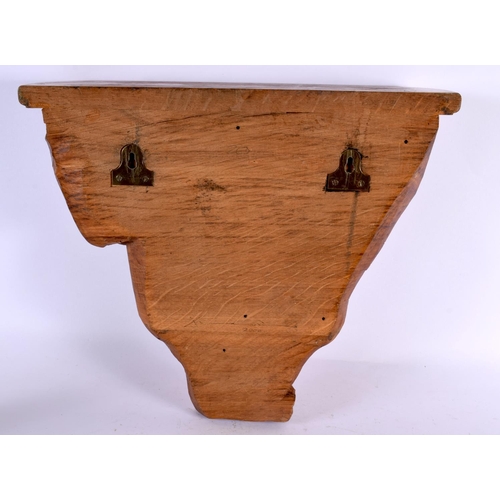 496 - A LOVELY ART DECO CARVED WOOD WALL BRACKET formed as a stylised female holding aloft a draped dress.... 