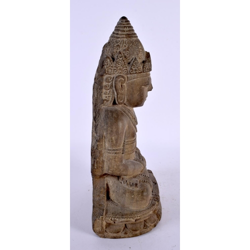 497 - A 19TH CENTURY SOUTH EAST ASIAN CARVED STONE FIGURE OF A BUDDHA modelled with hands clasped upon a l... 