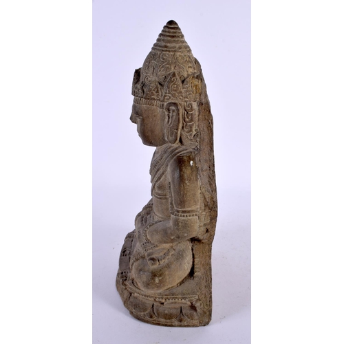 497 - A 19TH CENTURY SOUTH EAST ASIAN CARVED STONE FIGURE OF A BUDDHA modelled with hands clasped upon a l... 