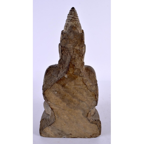 497 - A 19TH CENTURY SOUTH EAST ASIAN CARVED STONE FIGURE OF A BUDDHA modelled with hands clasped upon a l... 