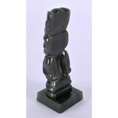 501 - A NEW ZEALAND TRIBAL CARVED JADE MAORI IDOL upon a square form base. 8 cm x 2 cm.