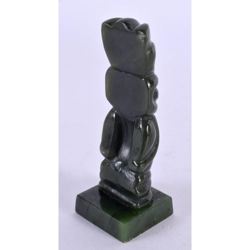 501 - A NEW ZEALAND TRIBAL CARVED JADE MAORI IDOL upon a square form base. 8 cm x 2 cm.