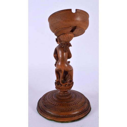 503 - A RARE 19TH CENTURY INDIAN CARVED SANDALWOOD POCKET WATCH HOLDER modelled as a monkey standing upon ... 