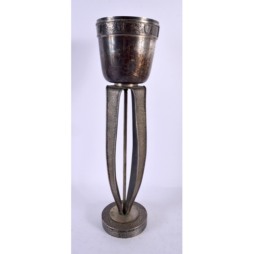 507 - A STYLISH ART NOUVEAU HAMMERED PEWTER ARMORIAL VASE bearing inscription to top. 38 cm x 10 cm.