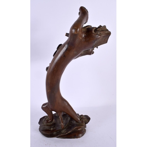 508 - AN UNUSUAL 19TH CENTURY CHINESE CARVED HARDWOOD FIGURE OF A DRAGON Qing, modelled standing upon a na... 