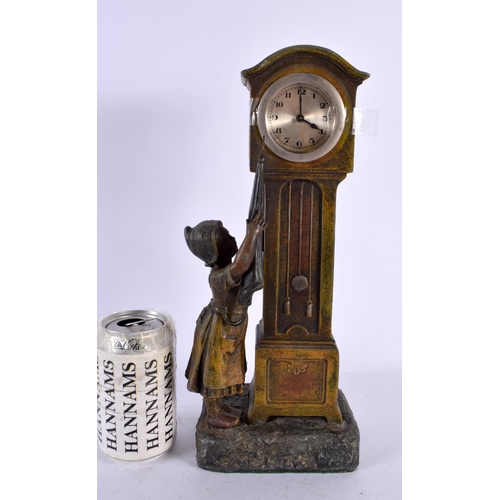 509 - AN EARLY 20TH CENTURY COLD PAINTED SPELTER MANTEL CLOCK formed as a child holding an umbrella beside... 