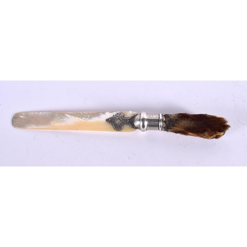 514 - A VICTORIAN TAXIDERMY ANIMAL CLAW AND MOTHER OF PEARL LETTER OPENER. 25 cm long.