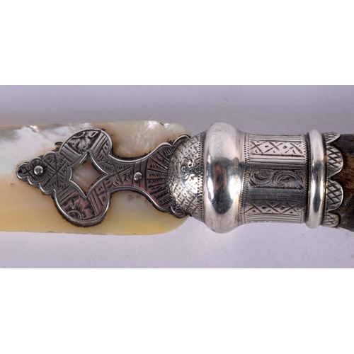 514 - A VICTORIAN TAXIDERMY ANIMAL CLAW AND MOTHER OF PEARL LETTER OPENER. 25 cm long.