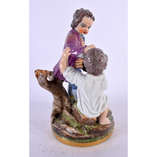 525 - A 19TH CENTURY CONTINENTAL PORCELAIN FIGURE OF TWO BOYS modelled fighting over a hat. 18 cm x 10 cm.