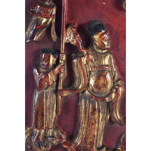 529 - A 19TH CENTURY CHINESE AND PAINTED LACQUERED WOOD PANEL Qing, depicting numerous figures within an i... 