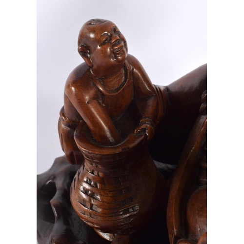 530 - A LARGE 19TH CENTURY CHINESE CARVED HARDWOOD FIGURE OF A MALE modelled holding a gourd beside a chil... 