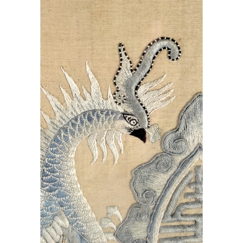 532 - A LARGE UNUSUAL 19TH CENTURY CHINESE SILK EMBROIDERED PANEL Qing, depicting opposing phoenix. 66 cm ... 