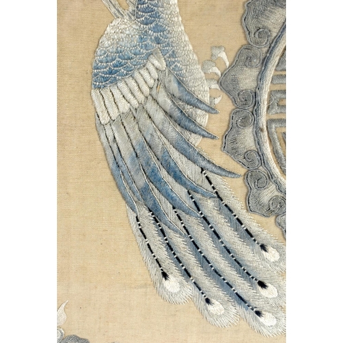 532 - A LARGE UNUSUAL 19TH CENTURY CHINESE SILK EMBROIDERED PANEL Qing, depicting opposing phoenix. 66 cm ... 