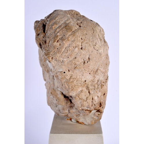 535 - A RARE ROMANO BRITISH CARVED LIMESTONE HEAD C200AD depicting an elderly male, upon a white painted w... 