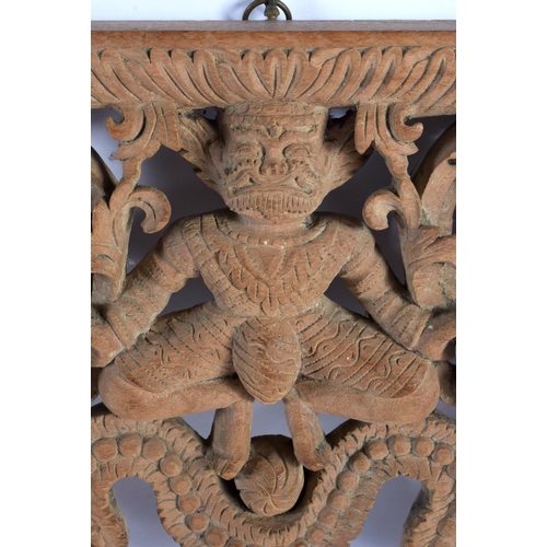 543 - A 19TH CENTURY BURMESE JAVANESE CARVED WOOD TEMPLE PANEL together with a similar Nepalese carved woo... 