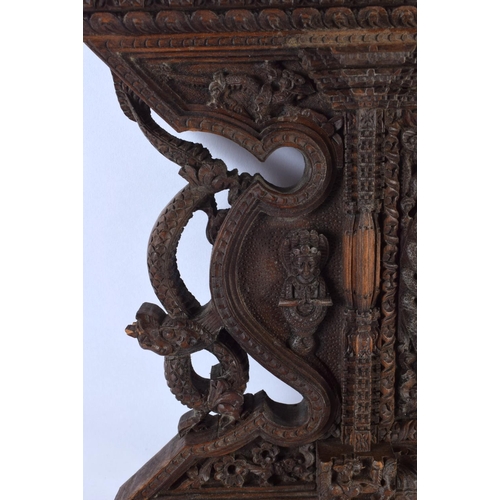 543 - A 19TH CENTURY BURMESE JAVANESE CARVED WOOD TEMPLE PANEL together with a similar Nepalese carved woo... 