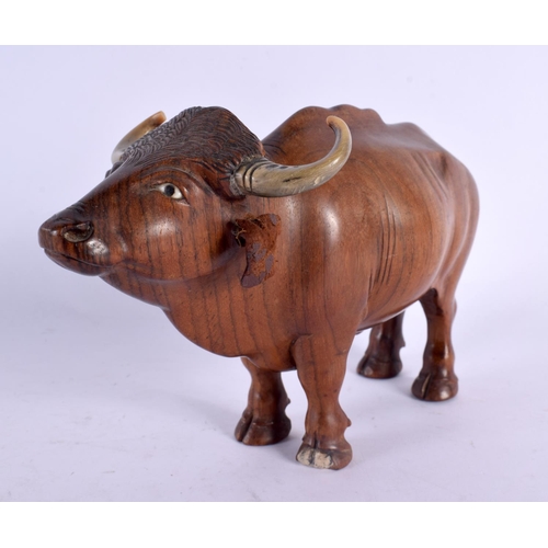 548 - A FINE 19TH CENTURY ANGLO INDIAN CARVED HARDWOOD AND HORN BULL. 18 cm x 12 cm.