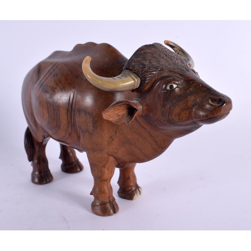 548 - A FINE 19TH CENTURY ANGLO INDIAN CARVED HARDWOOD AND HORN BULL. 18 cm x 12 cm.