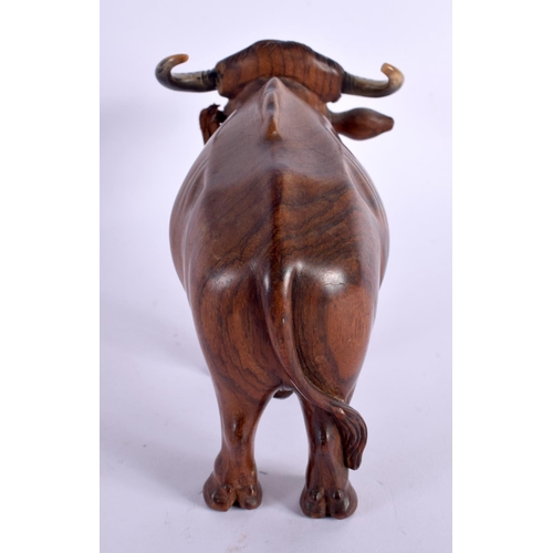 548 - A FINE 19TH CENTURY ANGLO INDIAN CARVED HARDWOOD AND HORN BULL. 18 cm x 12 cm.