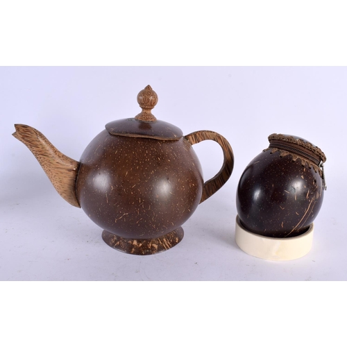 550 - AN UNUSUAL TRIBAL CARVED COCONUT TEAPOT AND COVER together with a similar coconut purse. Largest 21 ... 