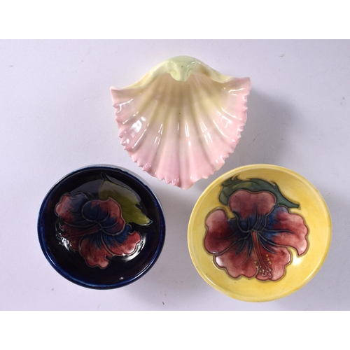 558 - TWO MOORCROFT HIBISCUS BOWLS C1936 to 1953 and a Worcester shell pin tray No 1904. Largest 8 cm wide... 