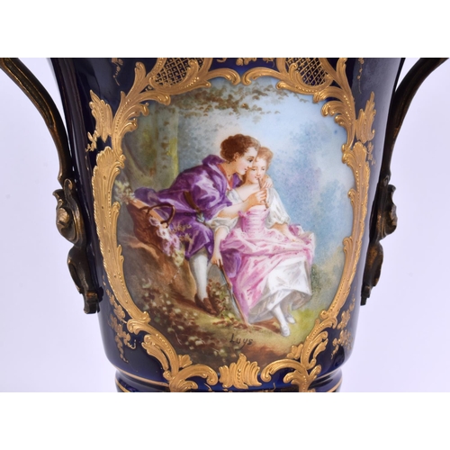 56 - A LARGE PAIR OF 19TH CENTURY FRENCH SEVRES PORCELAIN VASES AND COVERS painted with lovers in landsca... 