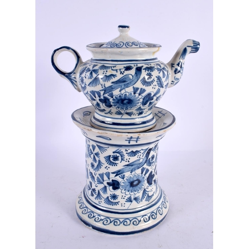 564 - A  DELFT BLUE AND WHITE TEAPOT ON STAND painted with birds and foliage. 21 cm x 15 cm.