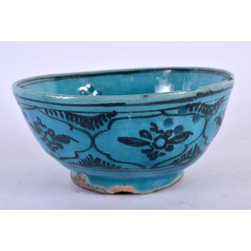 565 - AN ANTIQUE PERSIAN TURQUOISE GLAZED BOWL. 12 cm diameter.