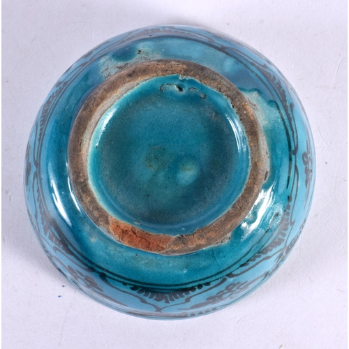 565 - AN ANTIQUE PERSIAN TURQUOISE GLAZED BOWL. 12 cm diameter.