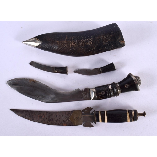 569 - TWO NEPALESE HORN HANDLED GURKHA KNIVES. 22 cm long. (2)