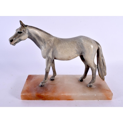 573 - A 19TH CENTURY AUSTRIAN COLD PAINTED BRONZE FIGURE OF A HORSE upon an onyx base. 24 cm x 20 cm.