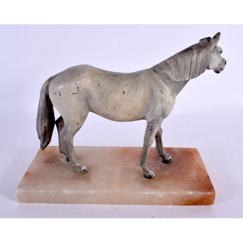 573 - A 19TH CENTURY AUSTRIAN COLD PAINTED BRONZE FIGURE OF A HORSE upon an onyx base. 24 cm x 20 cm.