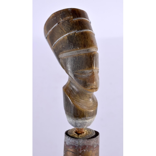 578 - AN UNUSUAL EARLY 20TH CENTURY MIDDLE EASTERN CARVED FULL LENGTH HORN WALKING CANE with Egyptian head... 