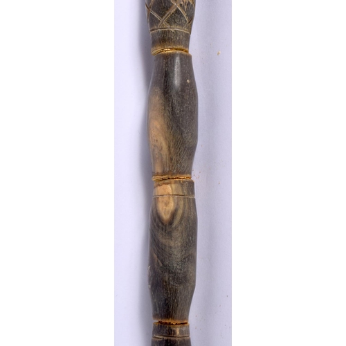 578 - AN UNUSUAL EARLY 20TH CENTURY MIDDLE EASTERN CARVED FULL LENGTH HORN WALKING CANE with Egyptian head... 