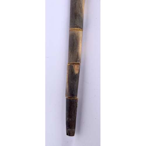 578 - AN UNUSUAL EARLY 20TH CENTURY MIDDLE EASTERN CARVED FULL LENGTH HORN WALKING CANE with Egyptian head... 