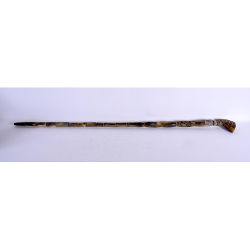 578 - AN UNUSUAL EARLY 20TH CENTURY MIDDLE EASTERN CARVED FULL LENGTH HORN WALKING CANE with Egyptian head... 