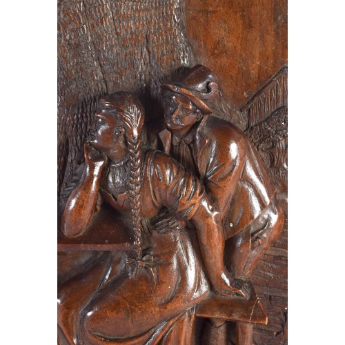 587 - AN ANTIQUE BAVARIAN BLACK FOREST CARVED WOOD PLAQUE. 24 cm x 18 cm.