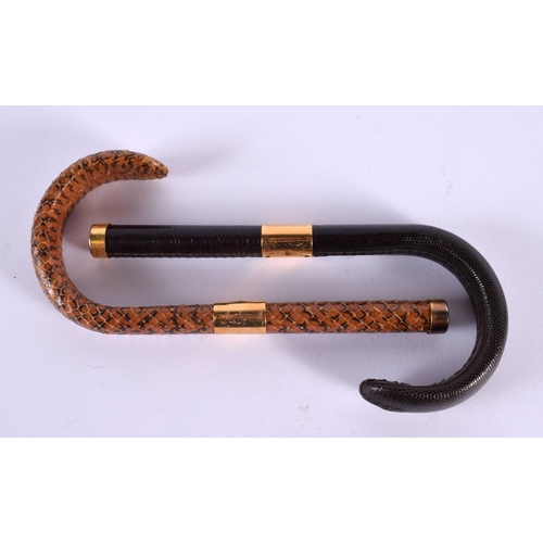 588 - TWO VINTAGE SNAKESKIN CANE HANDLES. 18 cm long. (2)