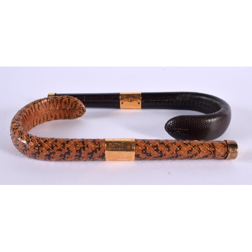 588 - TWO VINTAGE SNAKESKIN CANE HANDLES. 18 cm long. (2)