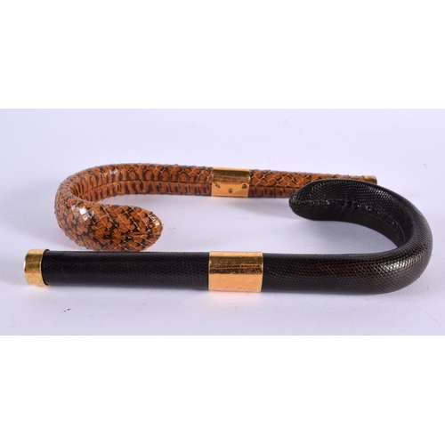 588 - TWO VINTAGE SNAKESKIN CANE HANDLES. 18 cm long. (2)