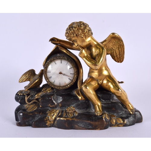 594 - AN EARLY 19TH CENTURY FRENCH EMPIRE GILT BRONZE CLOCK of small proportions. 15 cm x 12 cm.