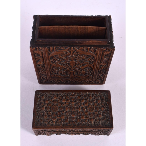 596 - A 19TH CENTURY ANGLO INDIAN CARVED WOOD BOX AND COVER decorated with foliage. 14 cm x 10 cm.