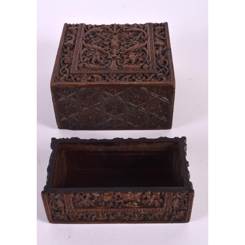 596 - A 19TH CENTURY ANGLO INDIAN CARVED WOOD BOX AND COVER decorated with foliage. 14 cm x 10 cm.