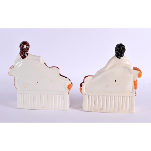 60 - A PAIR OF 19TH CENTURY STAFFORDSHIRE FIGURES OF A MALE AND FEMALE modelled upon a sofa. 22 cm x 17 c... 