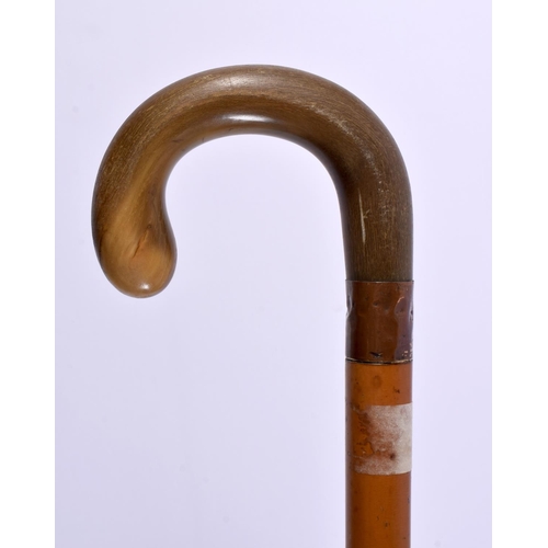 628 - A LARGE 19TH CENTURY MIDDLE EASTERN CARVED RHINOCEROS HORN HANDLED WALKING CANE. 90 cm long.