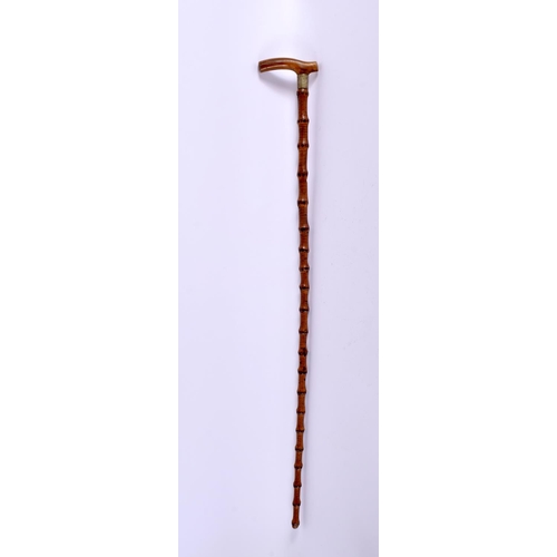 629 - A 19TH CENTURY MIDDLE EASTERN CARVED RHINOCEROS HORN SWAGGER STICK. 65 cm long.