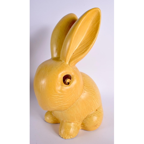 65 - A RARE EARLY 20TH CENTURY ENGLISH YELLOW GLAZED BLUNT NOSED BUNNY. 32 cm high.