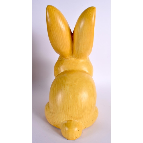 65 - A RARE EARLY 20TH CENTURY ENGLISH YELLOW GLAZED BLUNT NOSED BUNNY. 32 cm high.