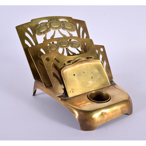 655 - AN ART NOUVEAU BRASS DESK STAND. 16 cm x 14 cm.